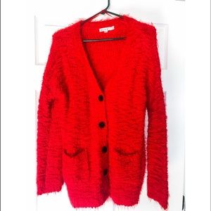 Red soft pocketed cardigan. Size small/medium
